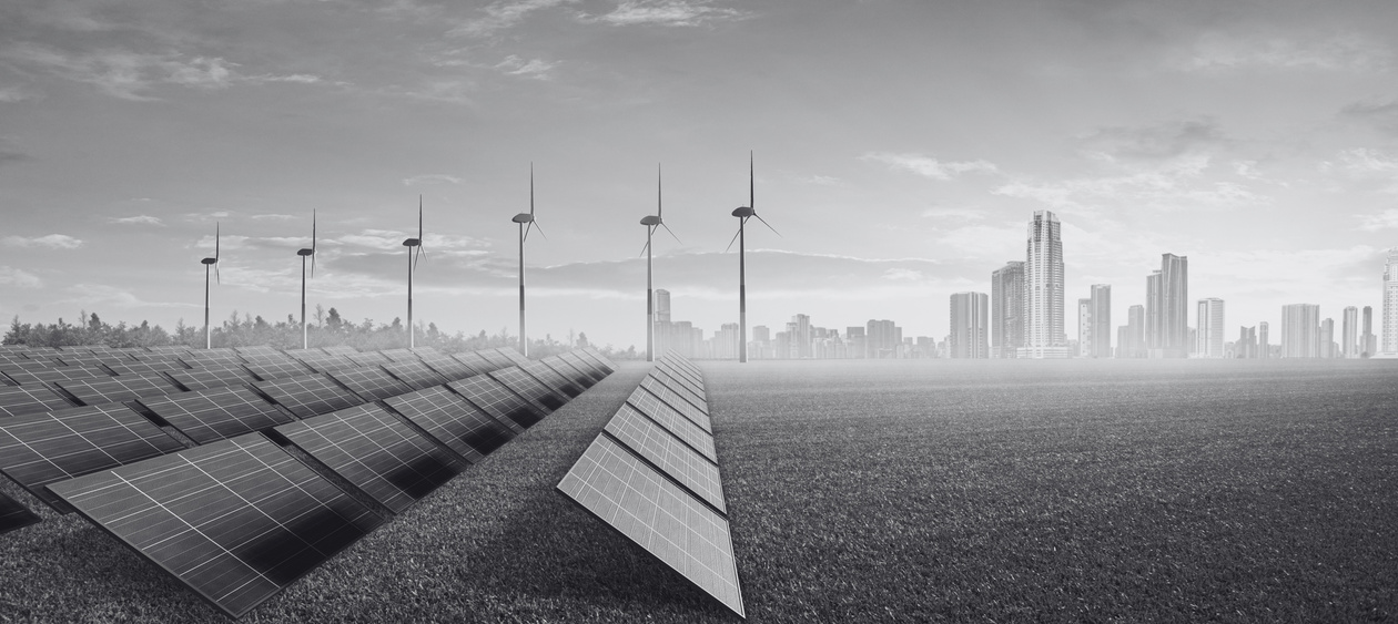 a black and white photo of wind turbines and solar panels